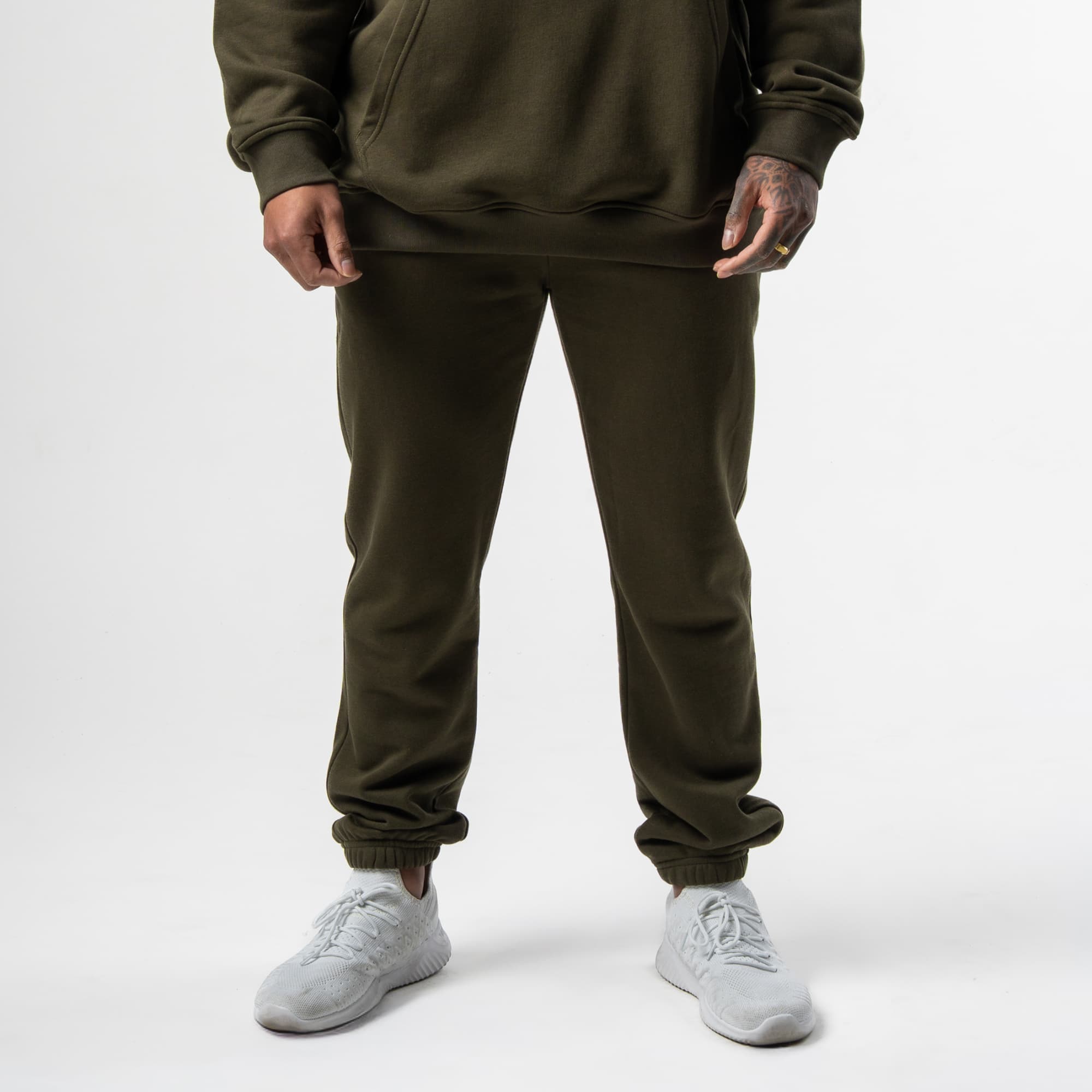 athlete wearing green axis joggers front view