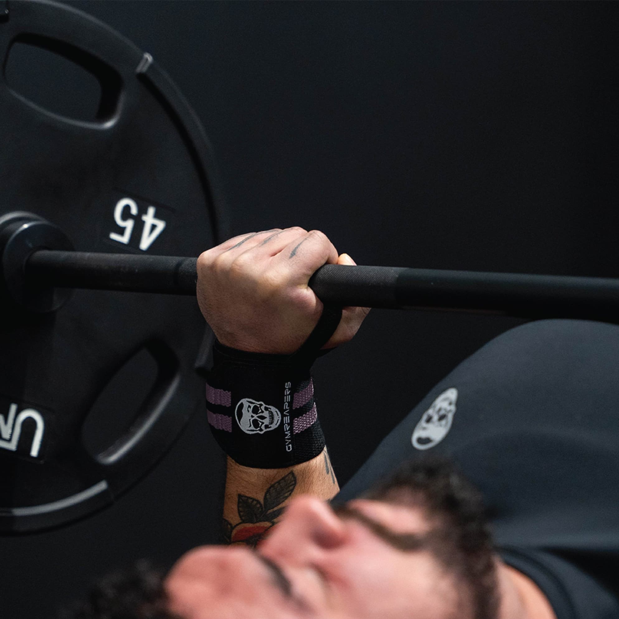 wrist wraps lilac being used during bench press