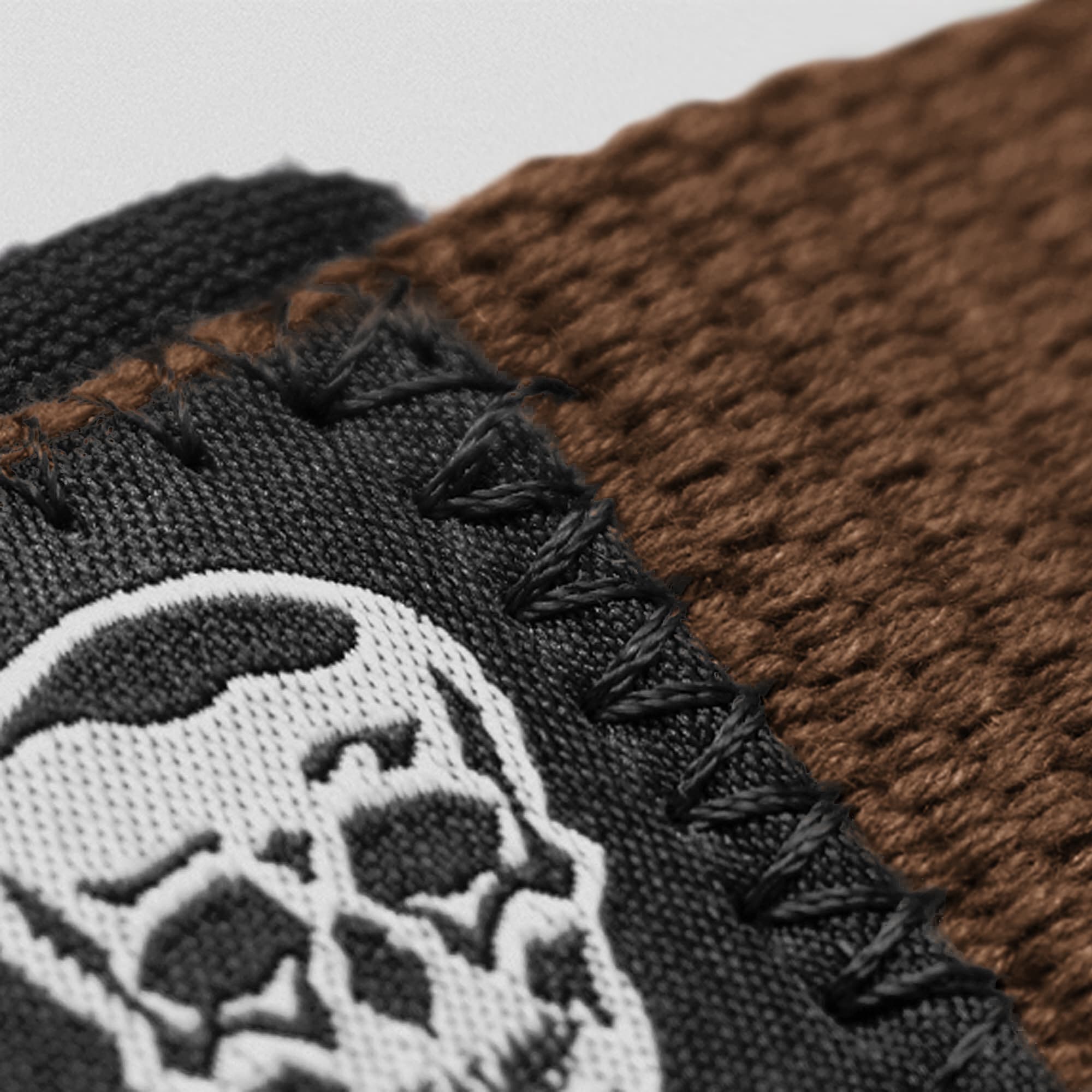 Brown Lifting Straps close up detail shot of logo