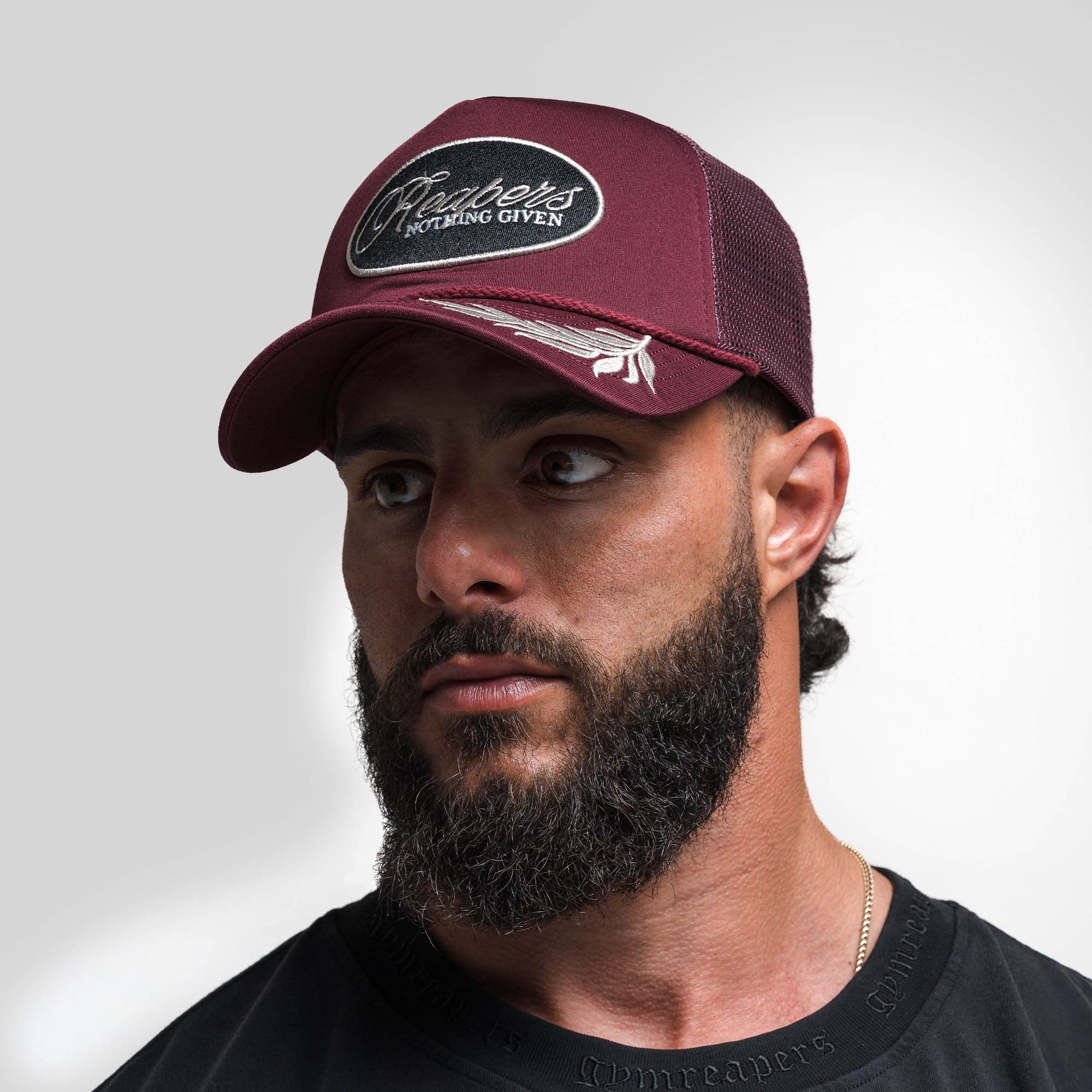 Athlete wearing Laurel Foam Trucker Hat - Maroon front view