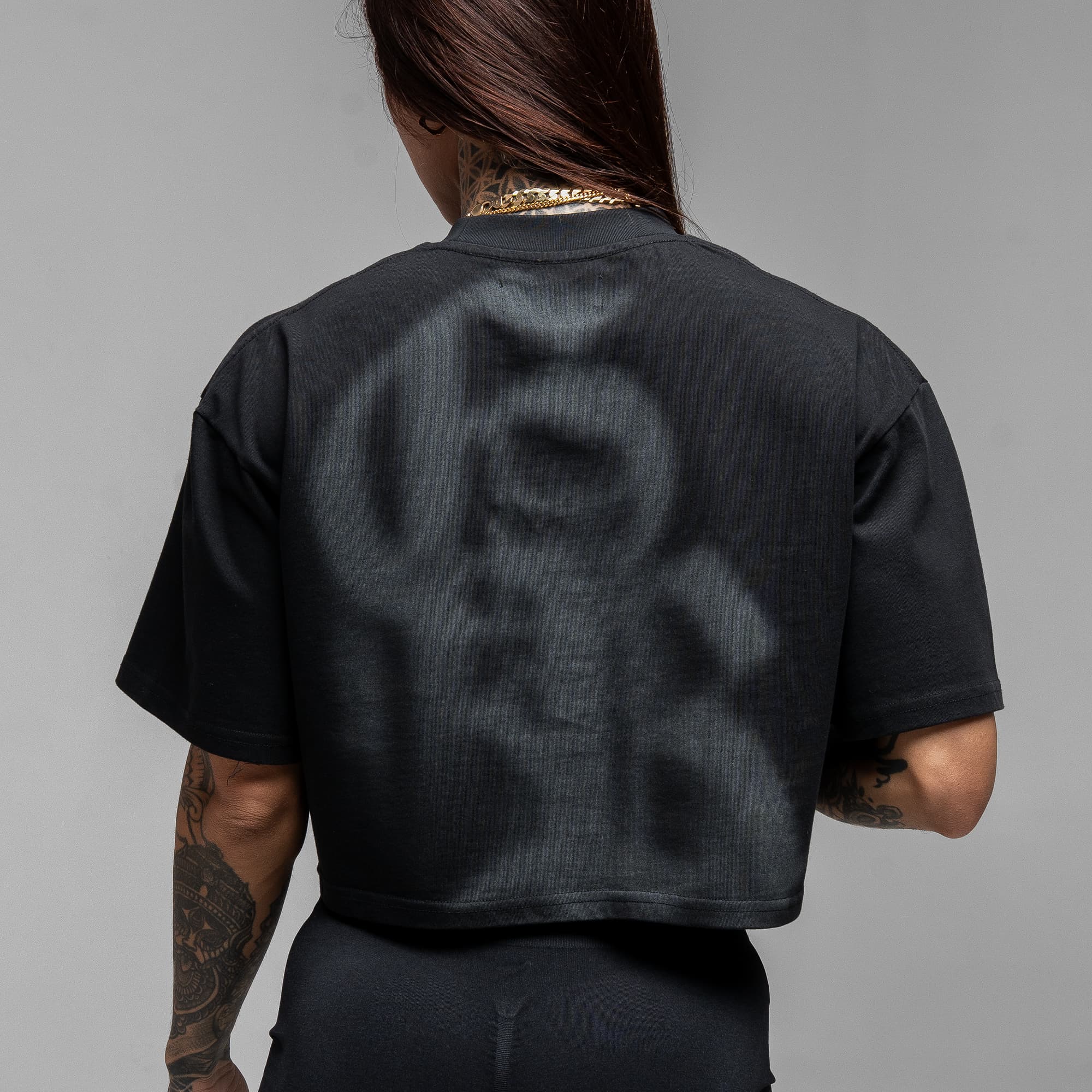 Athlete wearing GR Shadow Cropped Tee close up shot of back side