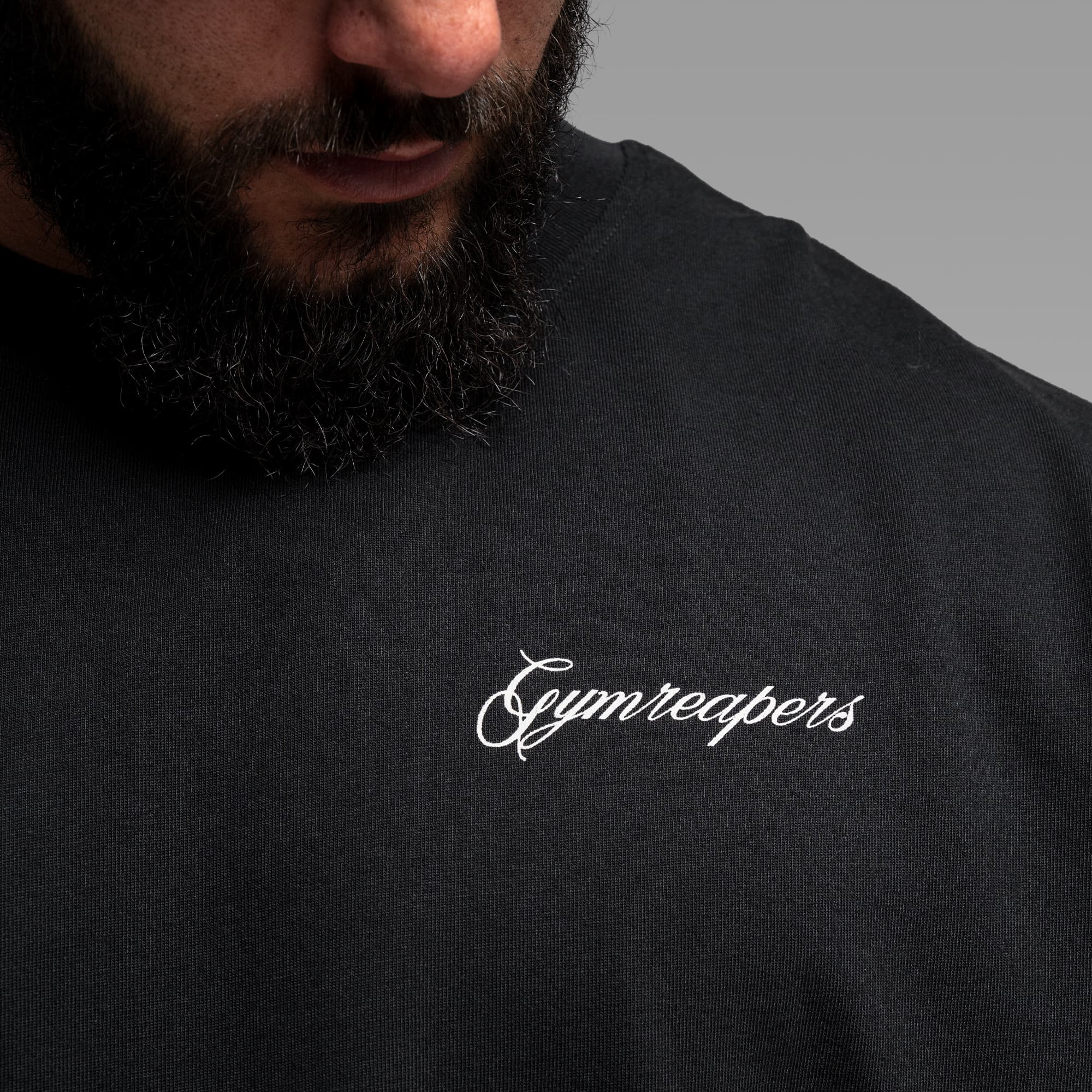 Athlete wearing the Midnight Reaper Cut Off close up shot of front graphic
