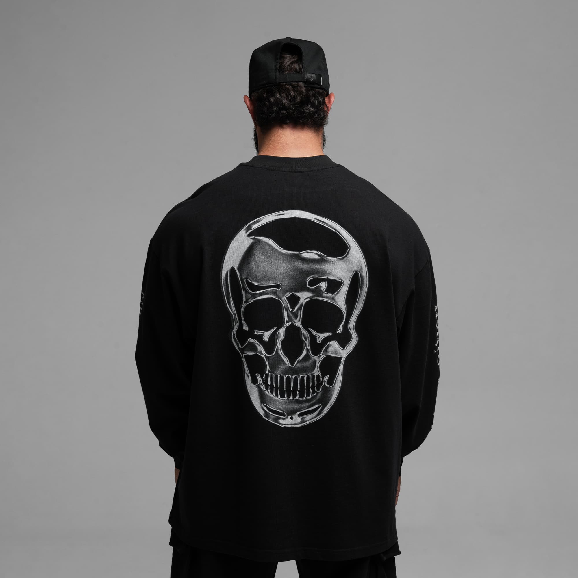 Athlete wearing Chrome Legacy Long Sleeve Shirt half body shot back side