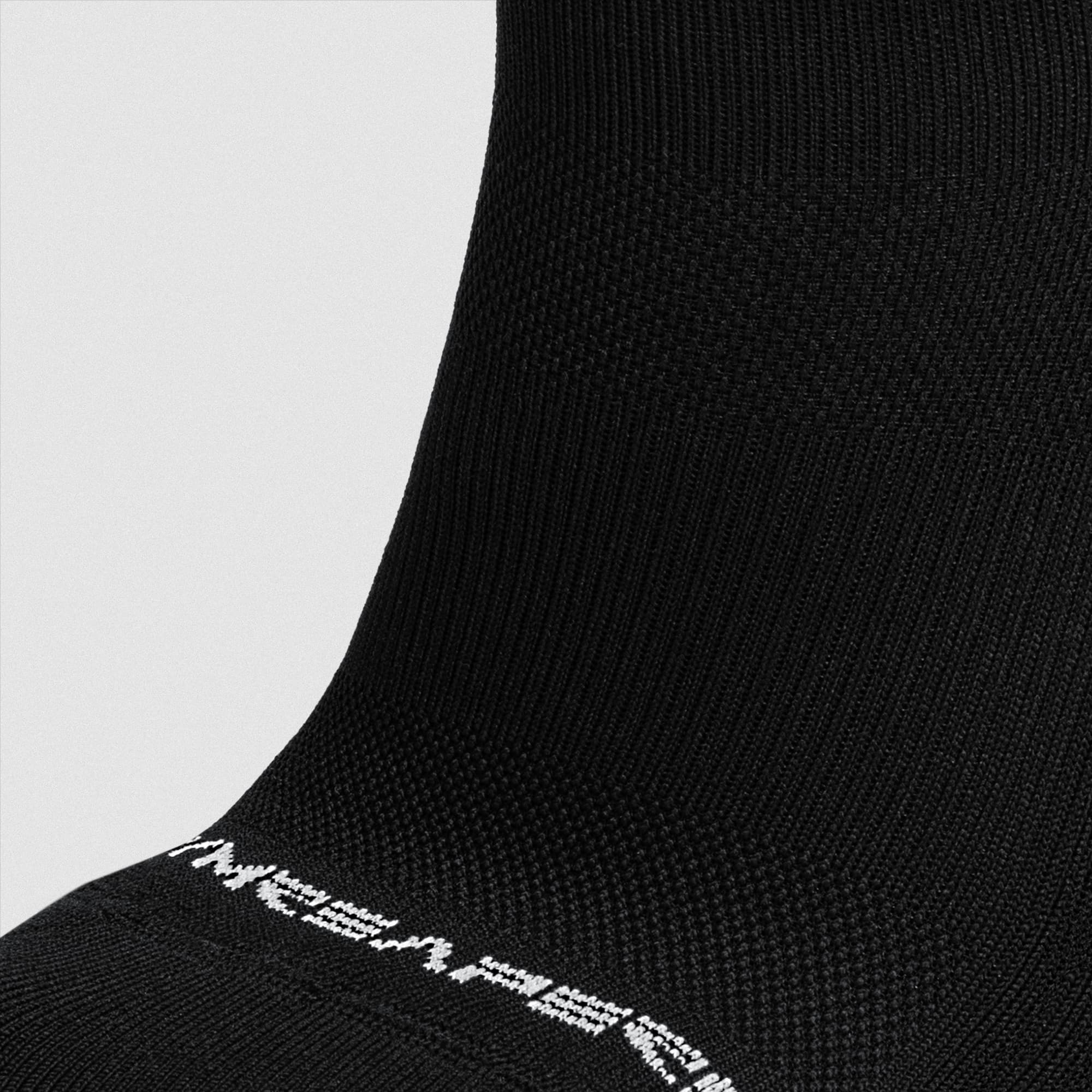 Black Stryda™ Crew Run Sock close up shot of fabric detail