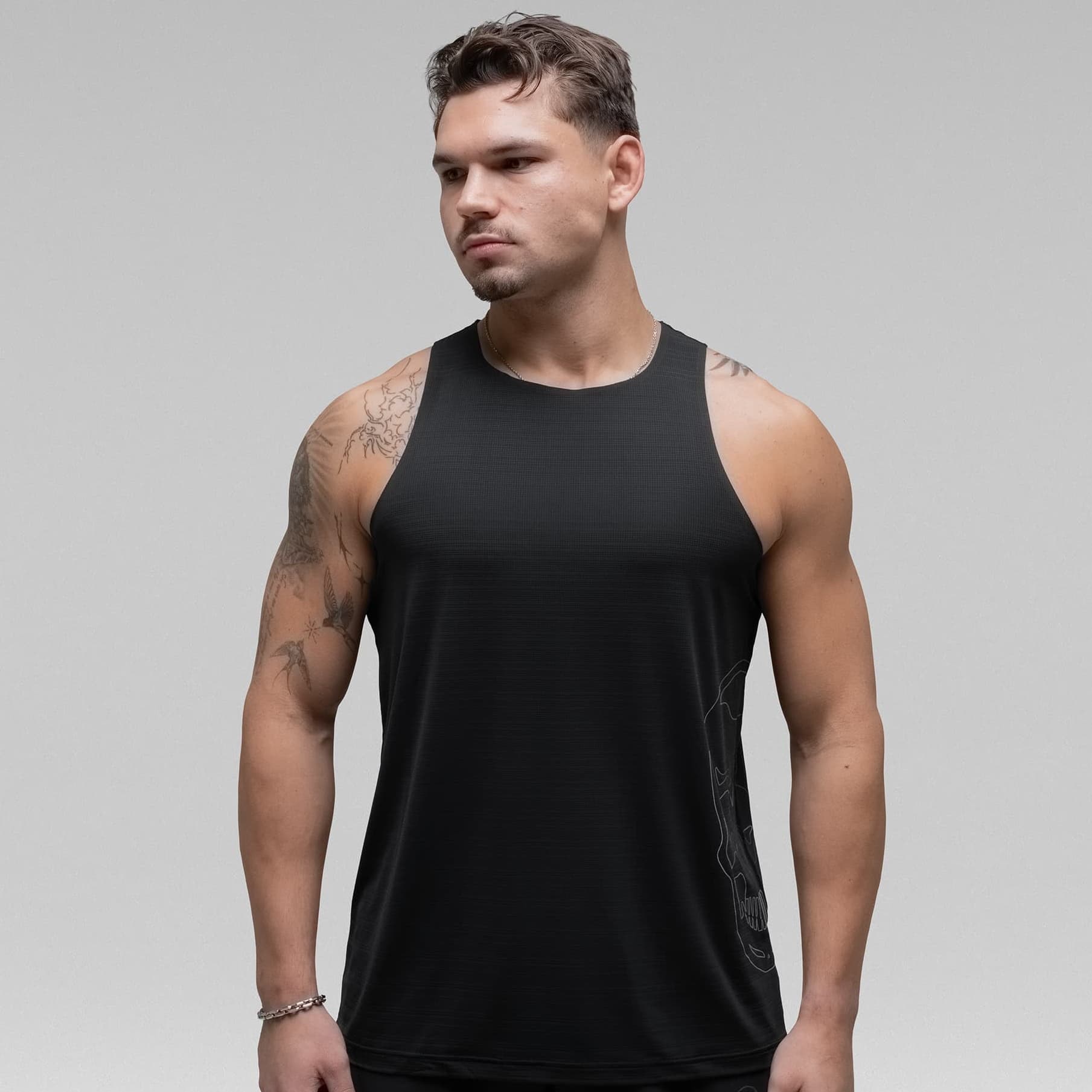 Athlete wearing the Ghost Racer Tank half body shot front view