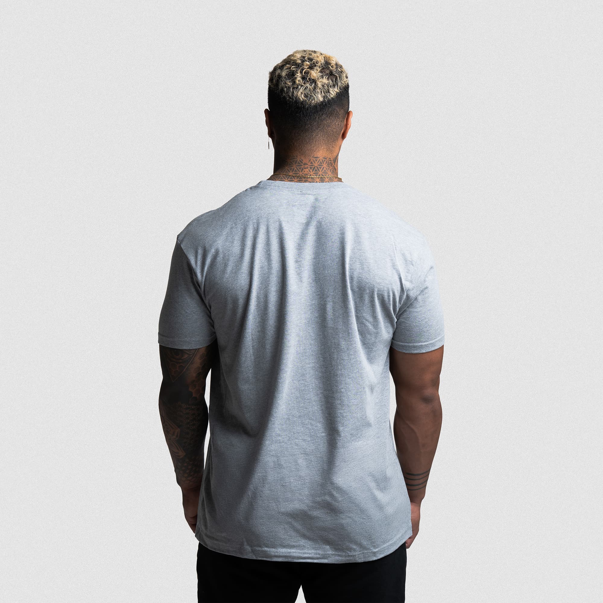Back view of athlete wearing the gray Reaper Training Club Tee showing athletic fit and sleeve length.