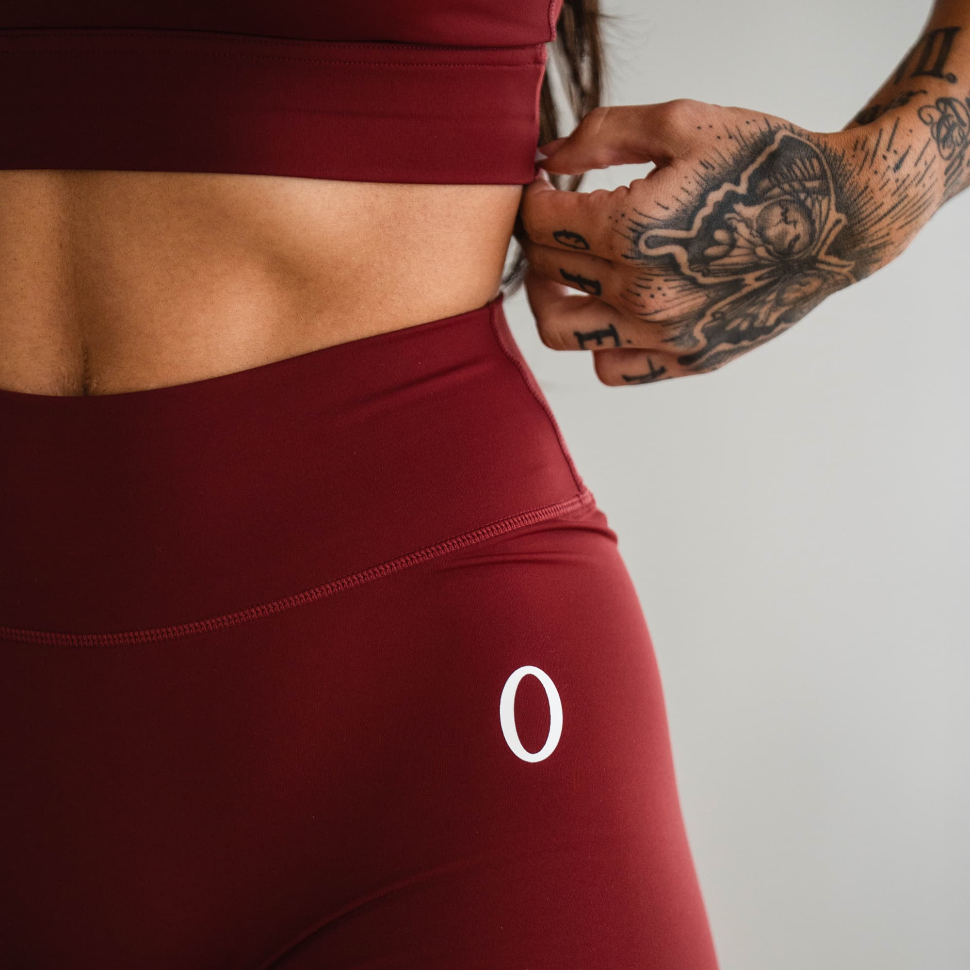Close-up of waistband and logo detail on the Olympia Training Leggings.