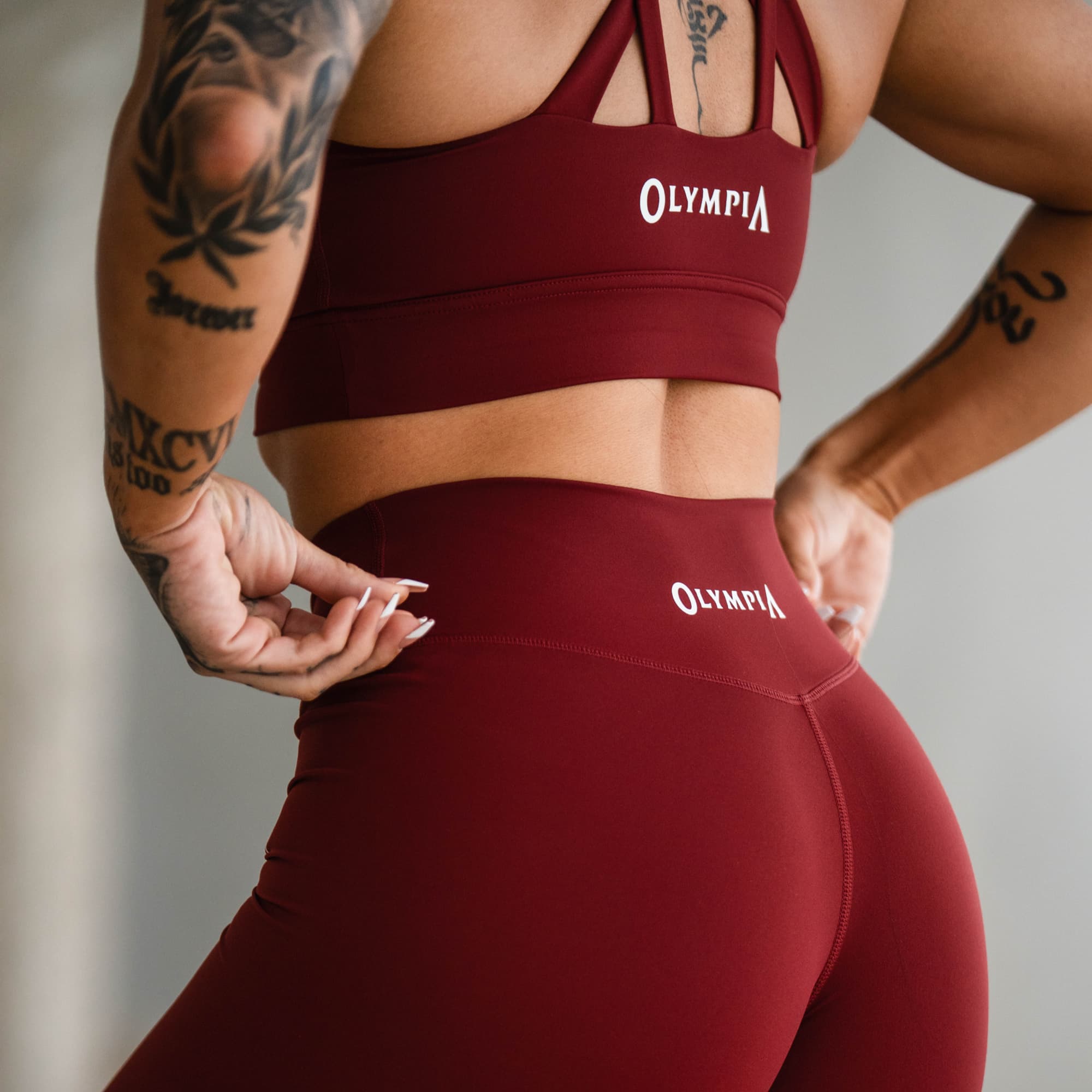 Back view close-up of waistband showing Olympia logo print.