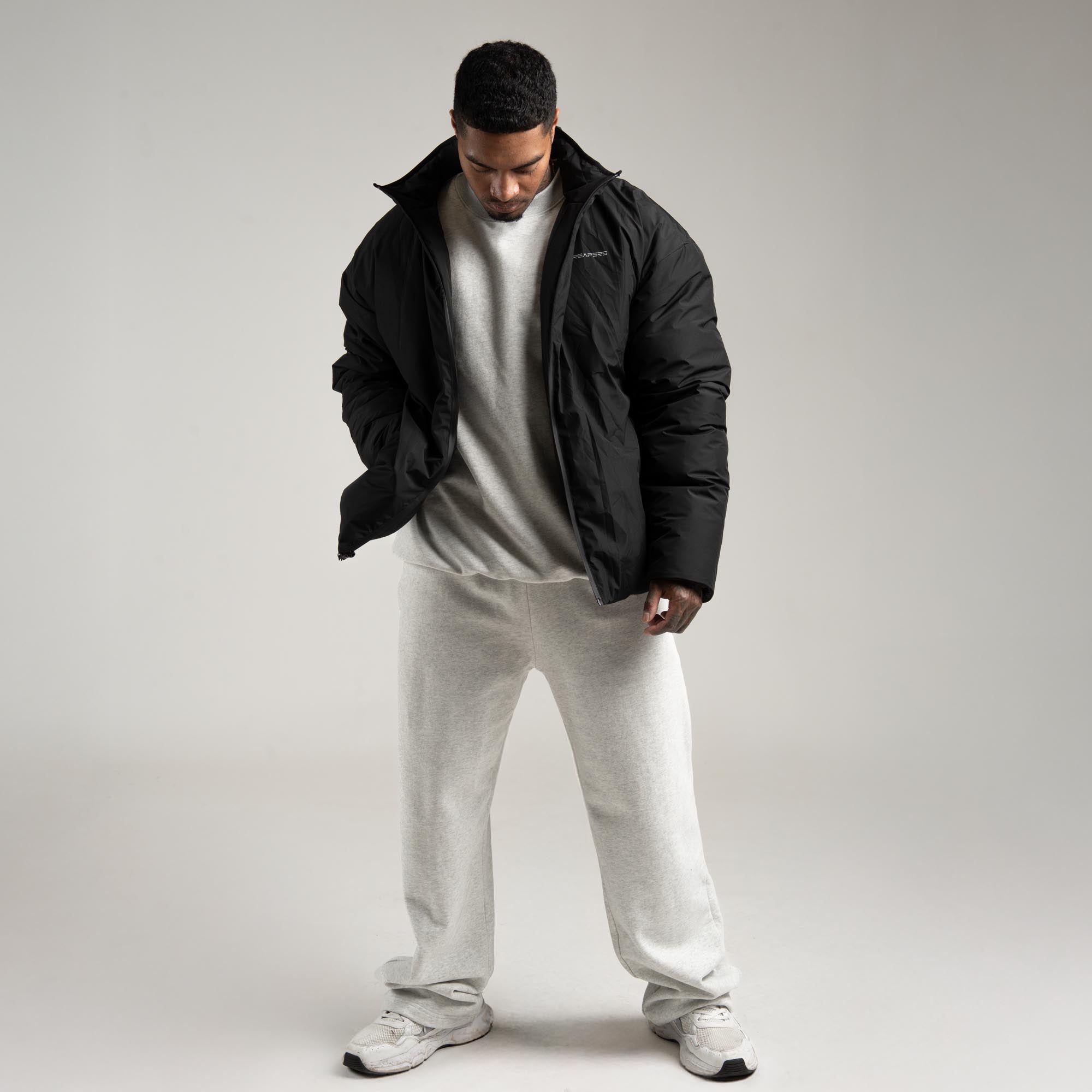 athlete wearing the Arktik Puffer Jacket full body shot front view