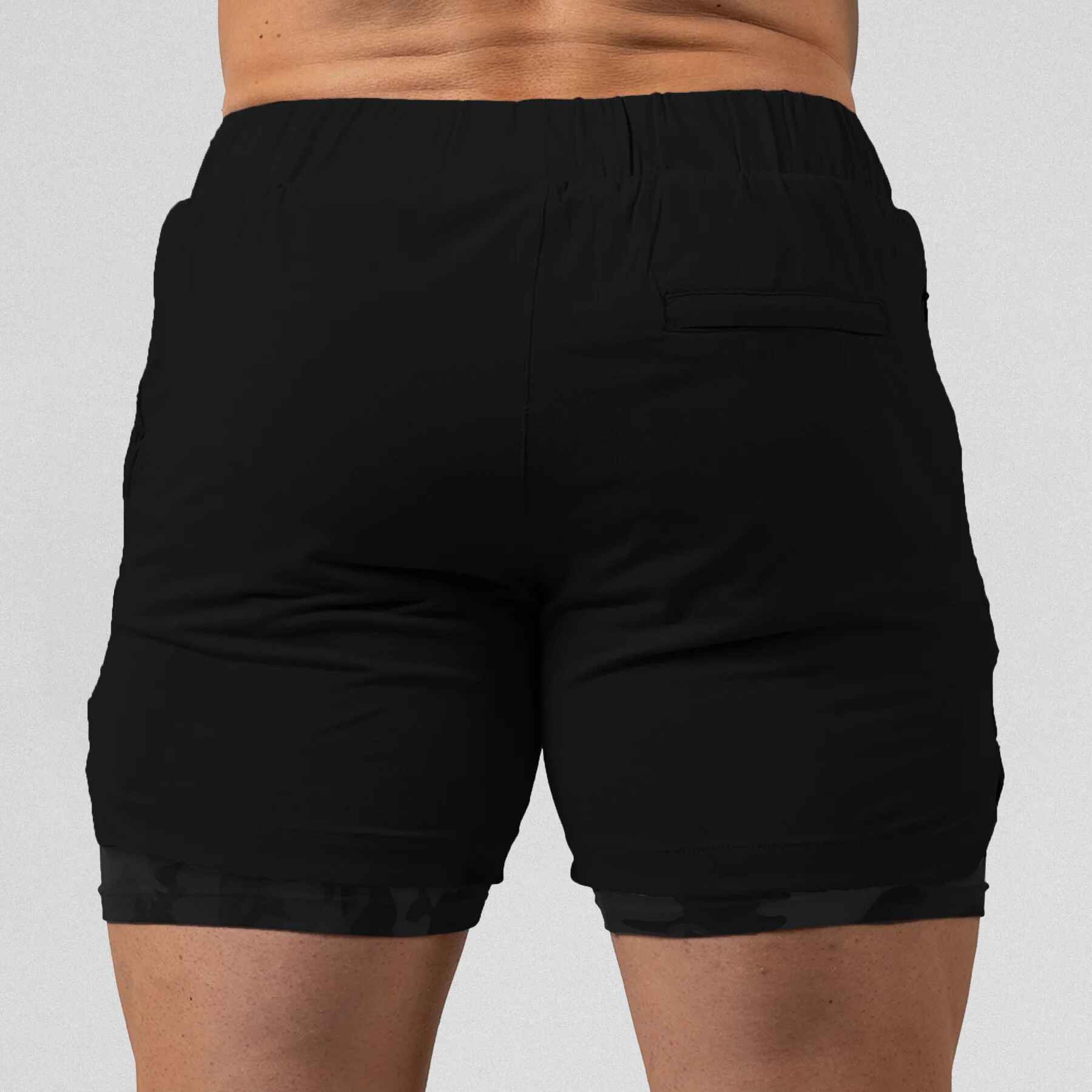 Gymreapers React training shorts black camo color way on athlete showcasing the back of the shorts.
