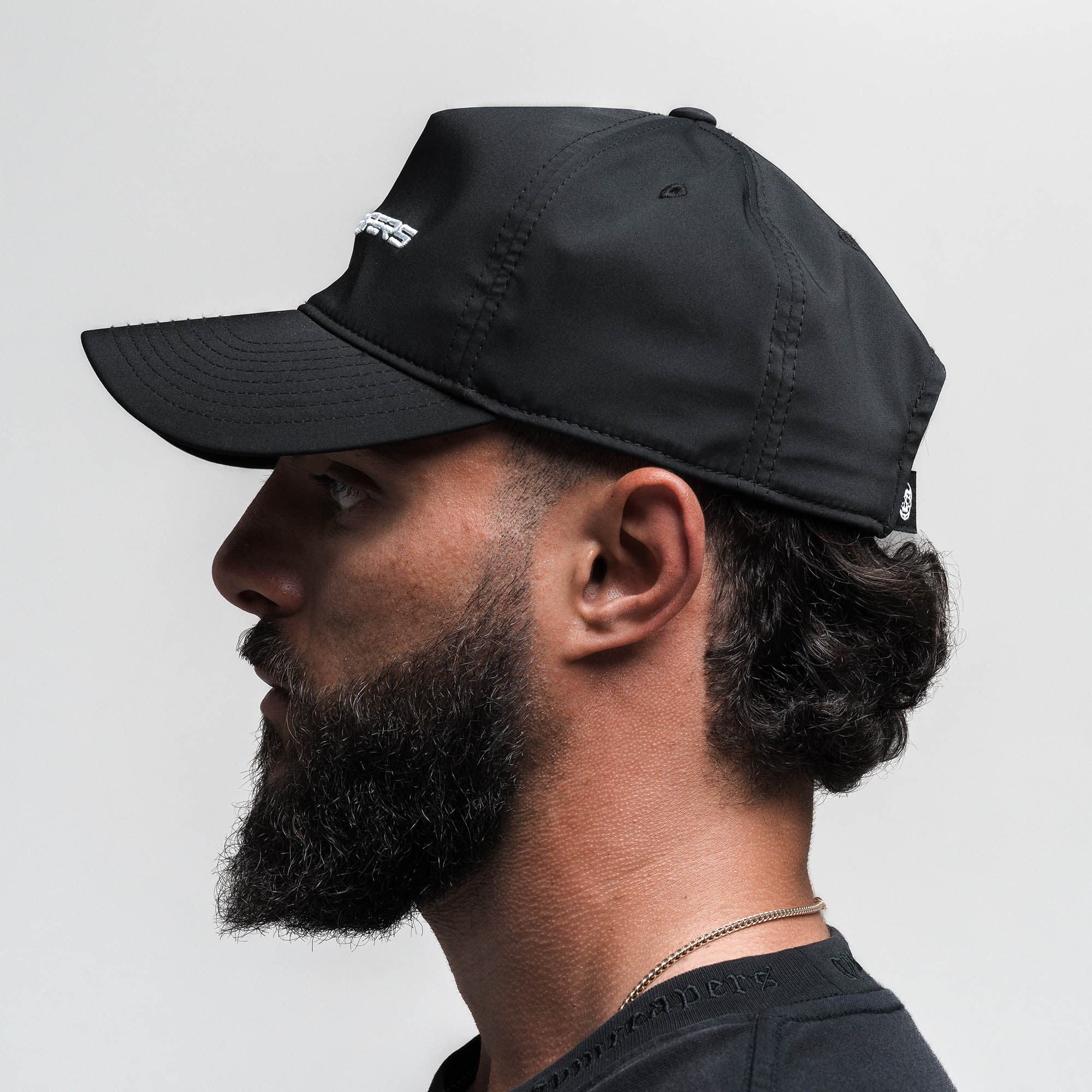 Athlete wearing Hybrid Performance Unstructured Hat - Gymreapers side view