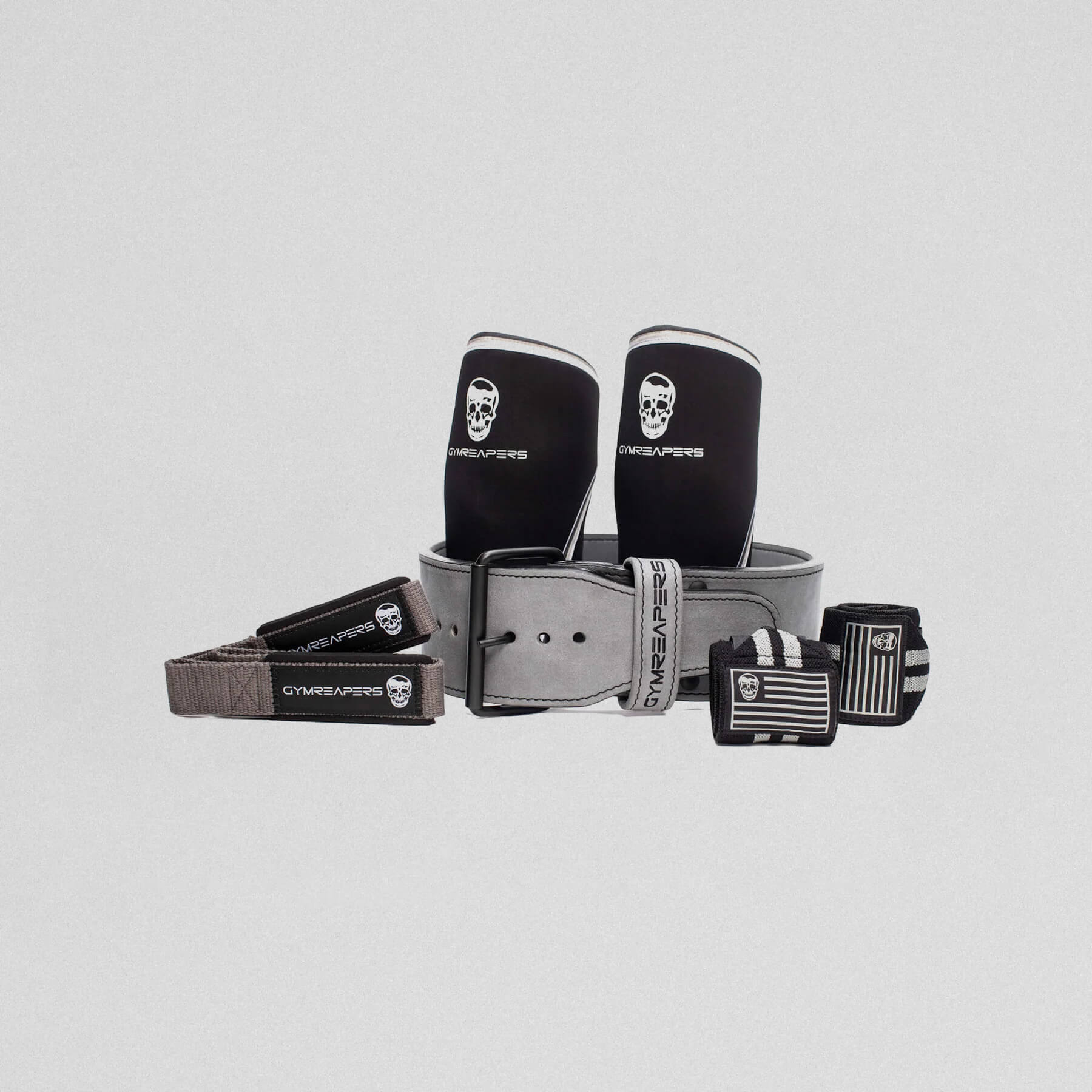 premium 10mm single prong strength kit, showcasing lifting straps, knee sleeves, wrist wraps and the 10mm single prong belt.