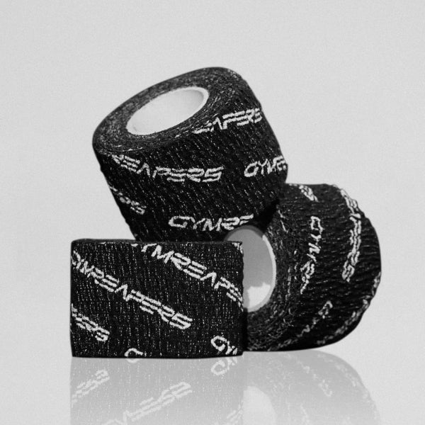 Gymreapers adhesive weightlifting grip tape black 3 rolls stacked on each other.