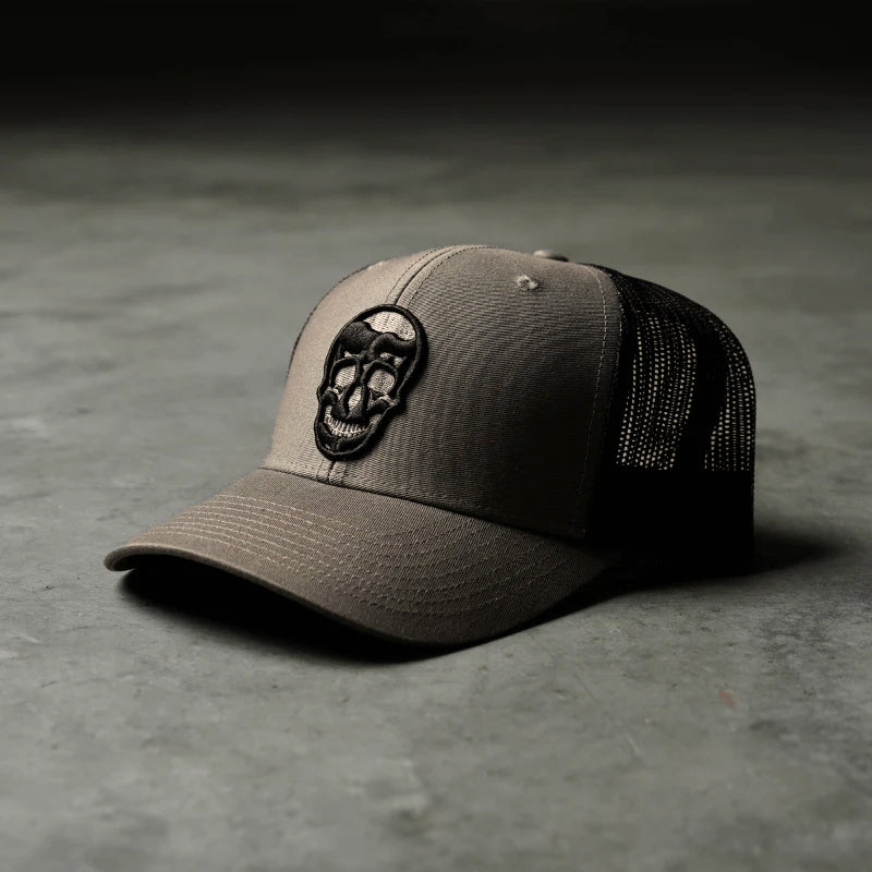 trucker hat fossil on concrete front